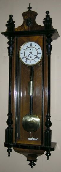 A 'Vienna' Wall Clock in an Ebonised and Walnut Case