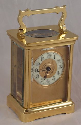 A French Brass Cased Carriage Clock with Enamel Chapter Ring