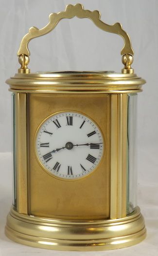 An Oval Cased French Brass Carriage Clock.