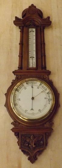 A Victorian Carved Oak Aneroid Barometer