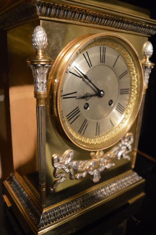 fig 1. French brass, gilt and silver mantel clock