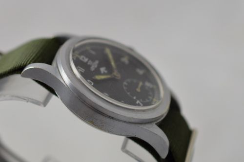 fig 1. Lemania Wrist Watch 1953 Fat Arrow Military Mark
