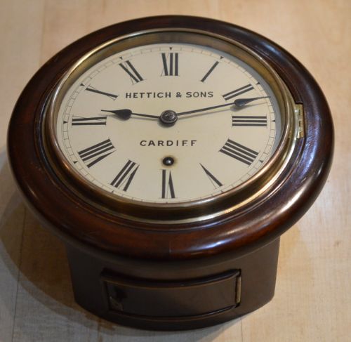A Rarer Small 7" Dial Wall Clock Retailed by Hettich & Sons of Cardiff