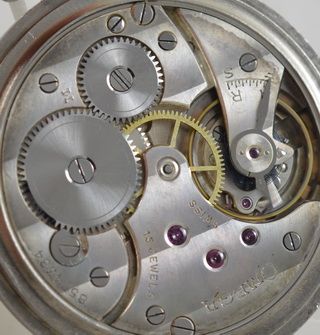 fig 1. 1936 Omega Stainless Steel Pocket Watch