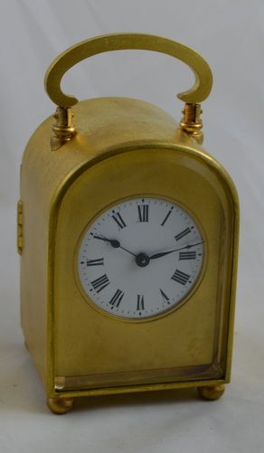 A Small French Gilt Carriage Clock