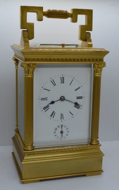 A Large Strike/repeat/alarm Corinthian Capped Striking Carriage Clock