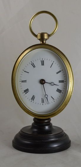 Oval Desk Clock in Bronze and Brass.