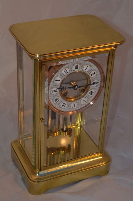 A Brass Four Glass Mantle Clock by Mougin, Paris