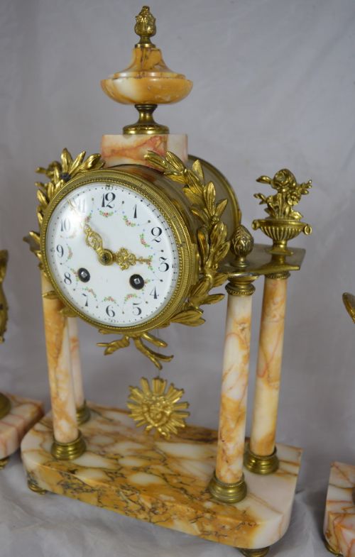 fig 1. A Marble Portico Clock with Matching Side Garnitures