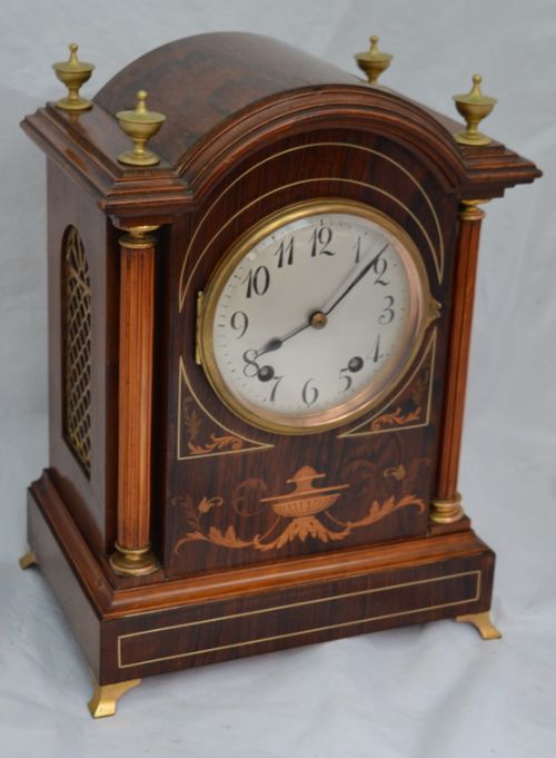 A Marquetry Inlaid Quarter Striking Mantle Clock
