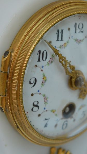 fig 1. Small French white marble mantel clock