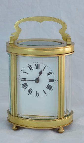 An Oval French Brass Carriage Clock