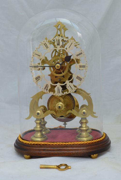 A Victorian Fusee Skeleton Clock & Glass Dome