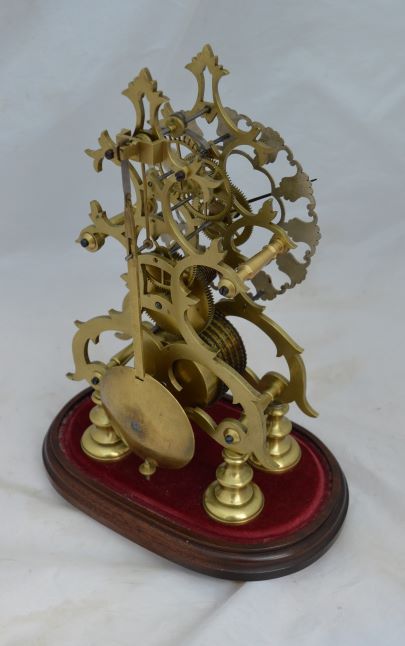fig 1. A Victorian Fusee Skeleton Clock & Glass Dome
