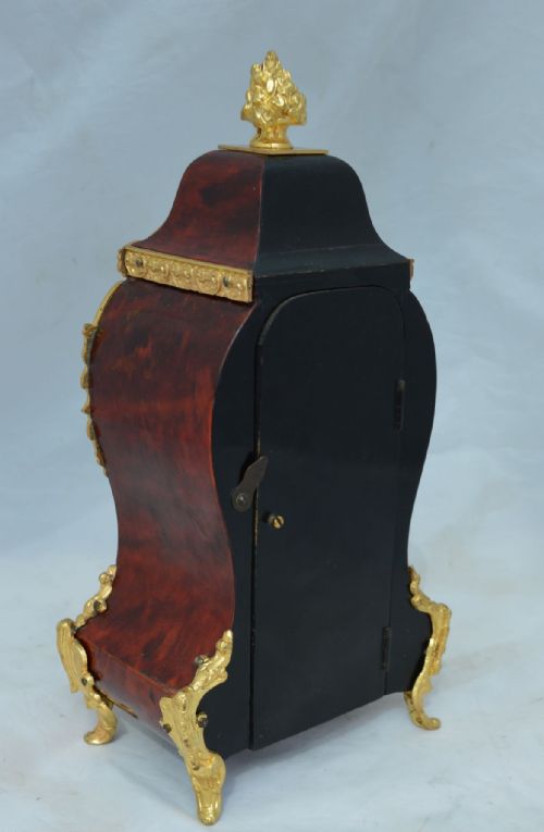 fig 1. A Red Tortoishell Mantel Clock