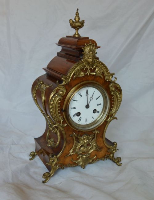 A Victorian Walnut Mantel Clock