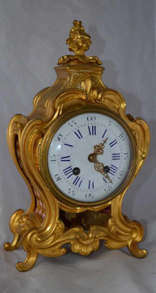 A Gilt Ormolu Rococo Mantel Clock