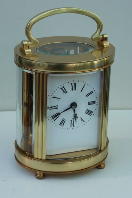 An Oval Cased Striking Carriage Clock