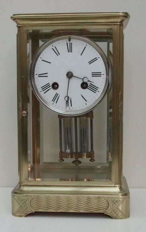 An Engraved 4 Glass Mantel Clock