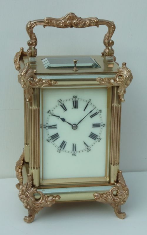 A French Rococo Mounted Strike/repeating Carriage Clock