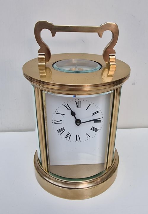 An Oval Cased Carriage Clock