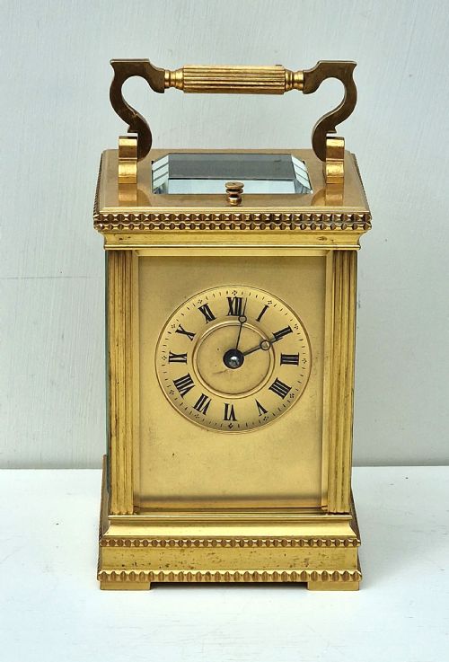 A Striking & Repeating Gilded Carriage Clock