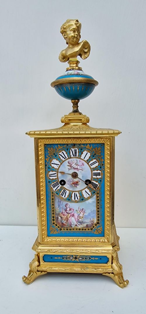 A SUPERB SEVRES PORCELAIN PANELLED GILT MANTEL CLOCK