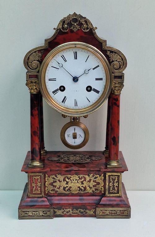 A Red Tortoishell Portico Clock