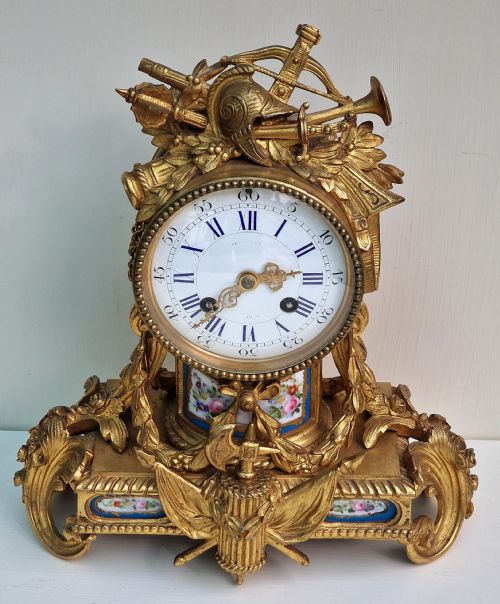 A Gilt Bronze Porcelain Panel Mantel Clock