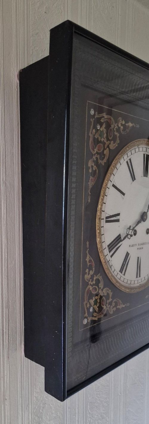 A square 19th-century French picture frame wall clock featuring an ebonised frame, an enamel dial signed Martin Baskett and Cie Paris, and brass and mother-of-pearl inlaid corner spandrels. View III