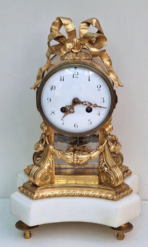 A Gilt & White Marble Mantel Clock