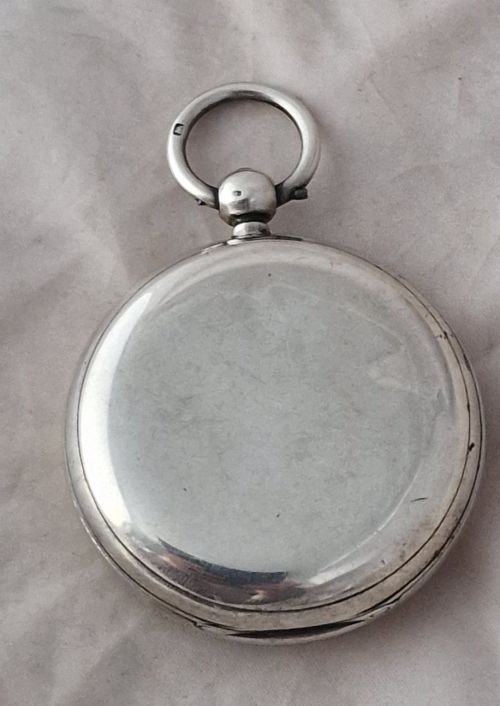 fig 1. An antique silver open face fusee pocket watch featuring a white enamel dial with black Roman numerals, a subsidiary seconds dial, and an accompanying winding key.