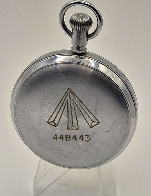 fig 1. A Second World War era Royal Navy Waltham submarine stopwatch featuring a chrome-plated metal casing and a cream dial with red and black numerals.