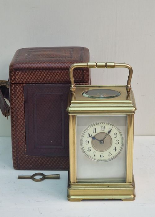 A Striking Carriage Clock & Box