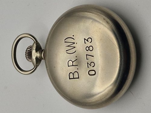 fig 1. An open-face silver-toned railway pocket watch with a white dial, blued steel hands, Arabic numerals, and a small seconds sub-dial.