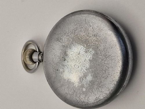 fig 1. An open-face WW2 British military pocket watch featuring a white dial, bold black Arabic numerals, aged hands, a sub-seconds dial, and a chrome-plated case.