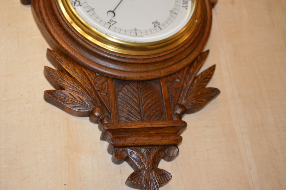 A Victorian carved oak barometer View II