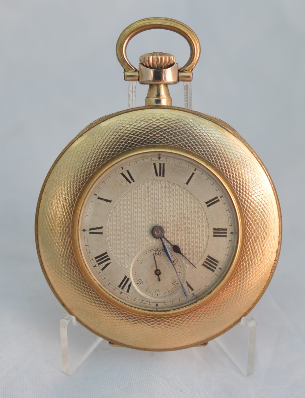 A slim gold plated pocket watch