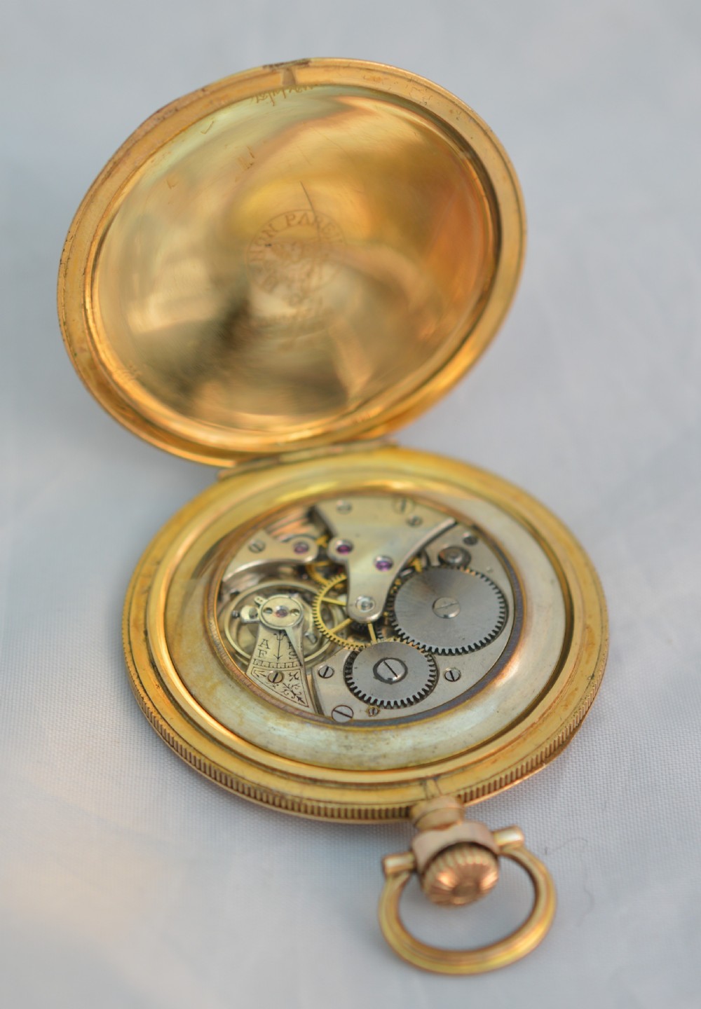 A slim gold plated pocket watch View III