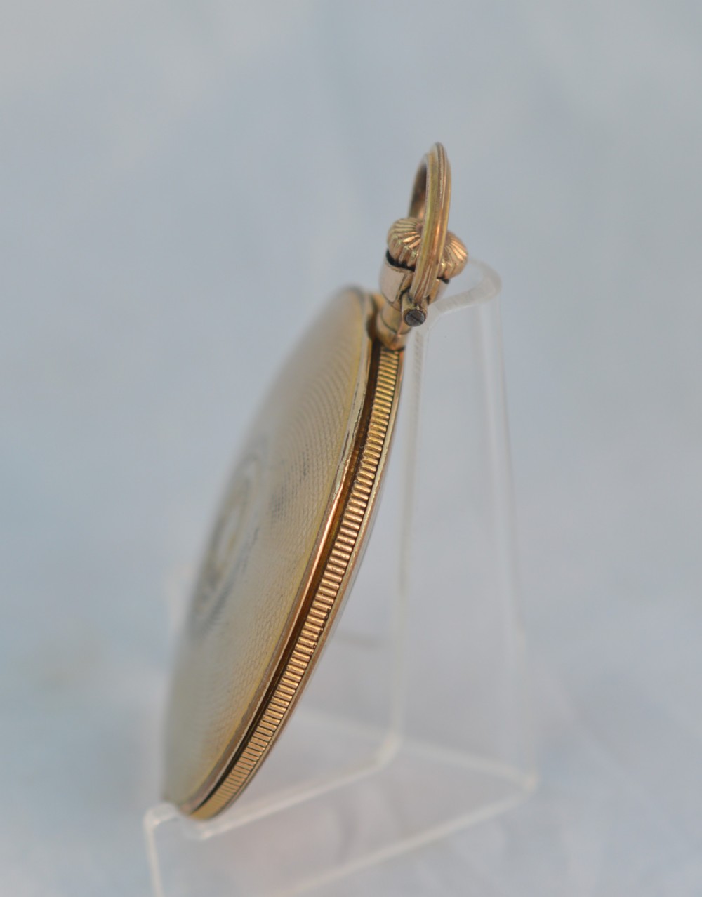 A slim gold plated pocket watch View V