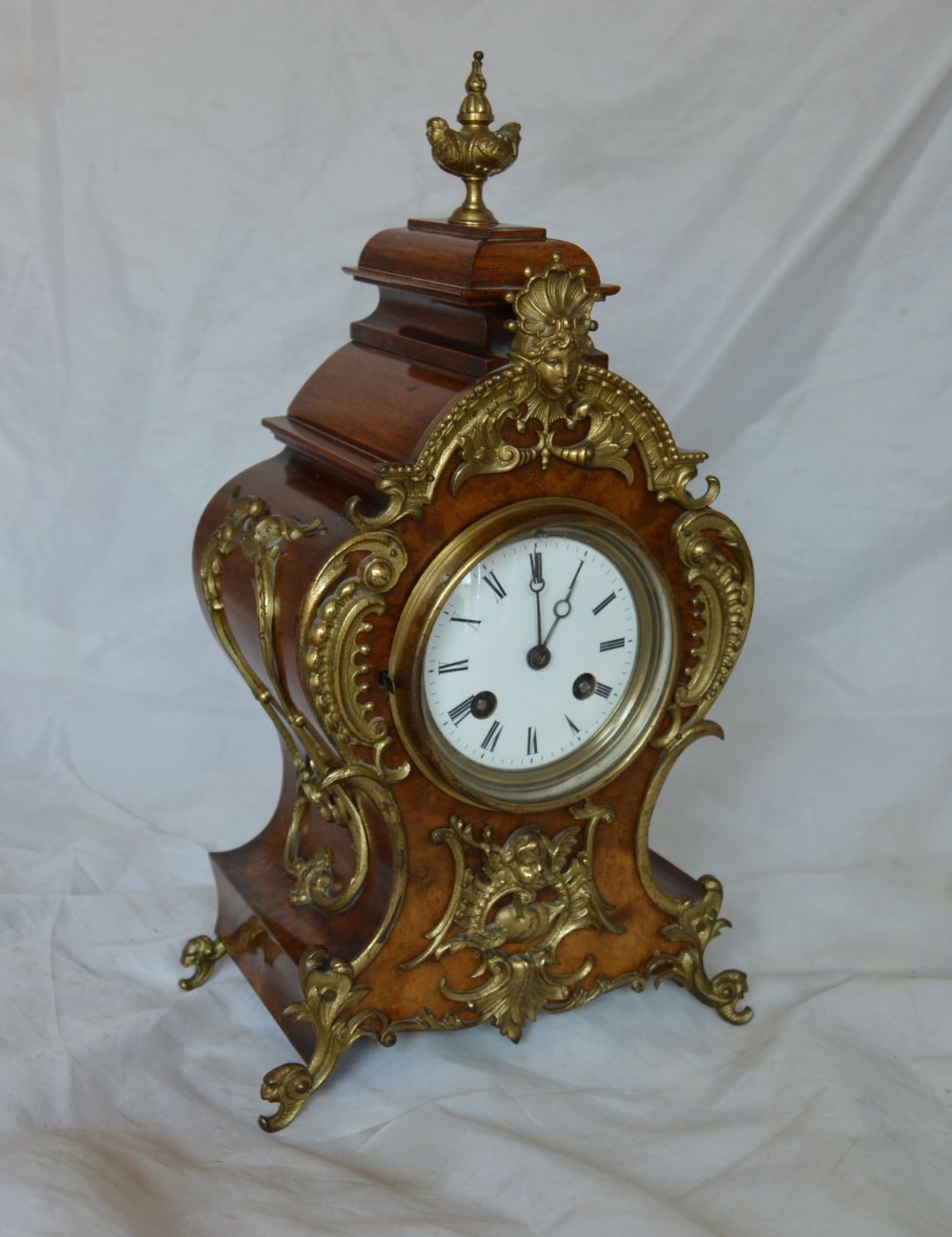 A Victorian Walnut Mantel Clock