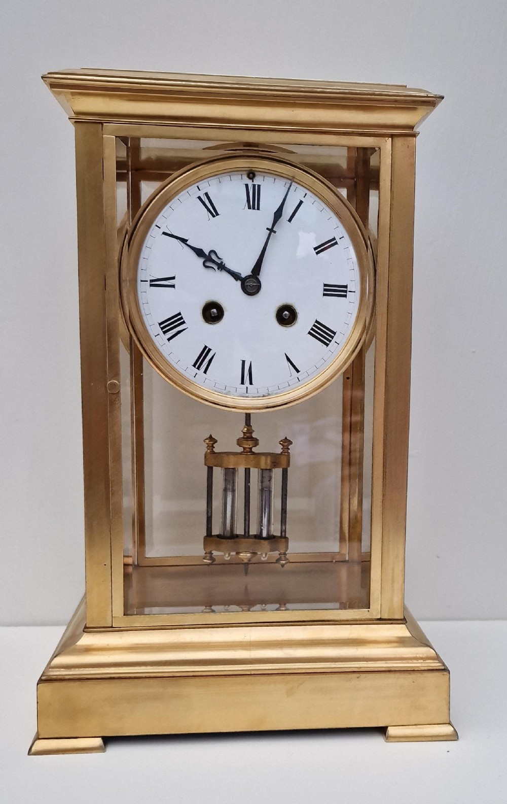 A Gilded Four Glass Mantel Clock