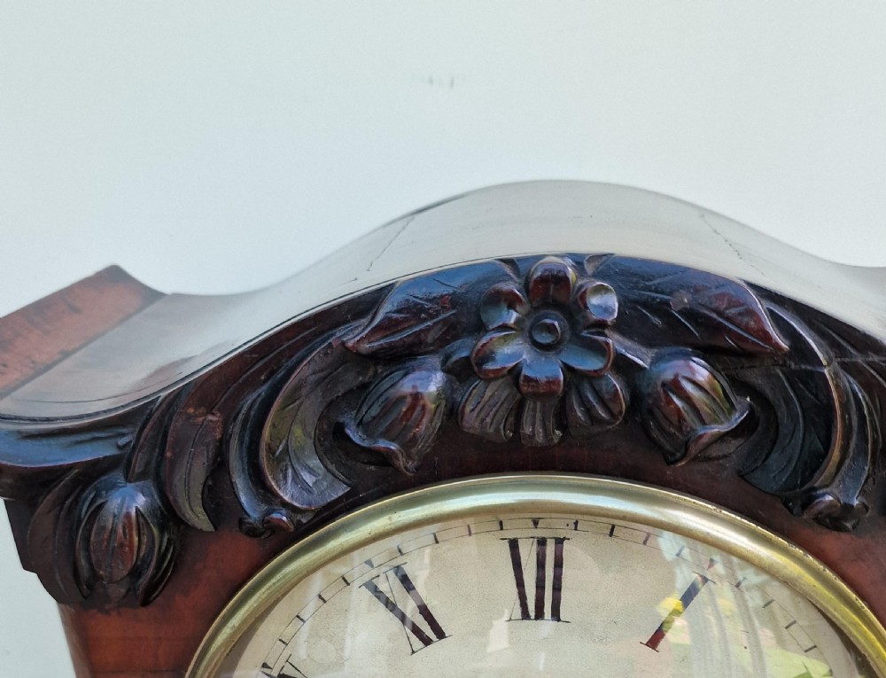 A Victorian carved mahogany fusee bracket clock featuring a circular white dial with Roman numerals inscribed Edw. Funnell Brighton within a brass bezel. View VIII