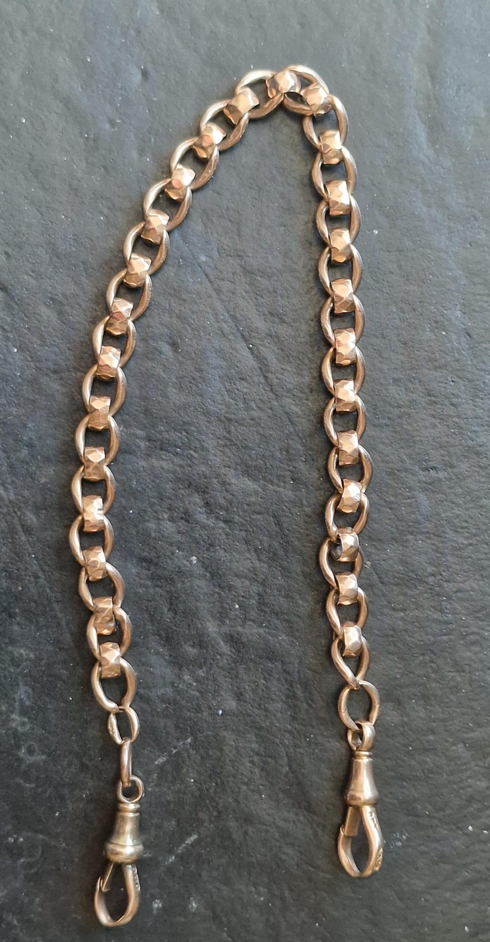 A Victorian 9k gold pocket watch chain