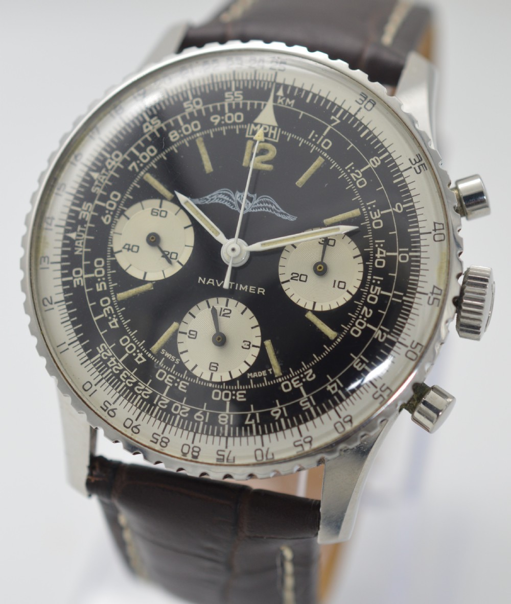 A vintage stainless steel Breitling Navitimer chronograph wristwatch featuring a black dial with white sub-dials, an AOPA wing emblem, slide rule bezel, and a brown leather strap. View II