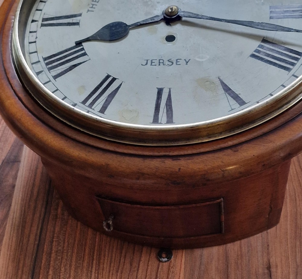A circular mahogany fusee wall clock featuring a white painted dial with Roman numerals, black hands, and a brass bezel surround. View II