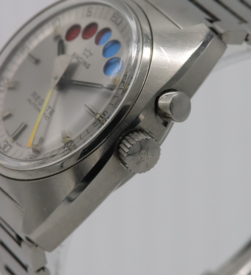 A 1970s Aquastar Regate vintage yacht racing watch featuring a stainless steel cushion case, integrated steel bracelet, and a silver dial with five regatta timer apertures. View III