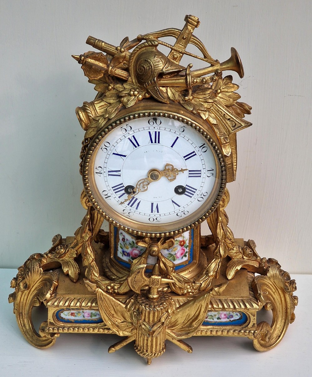 A Gilt Bronze Porcelain Panel Mantel Clock