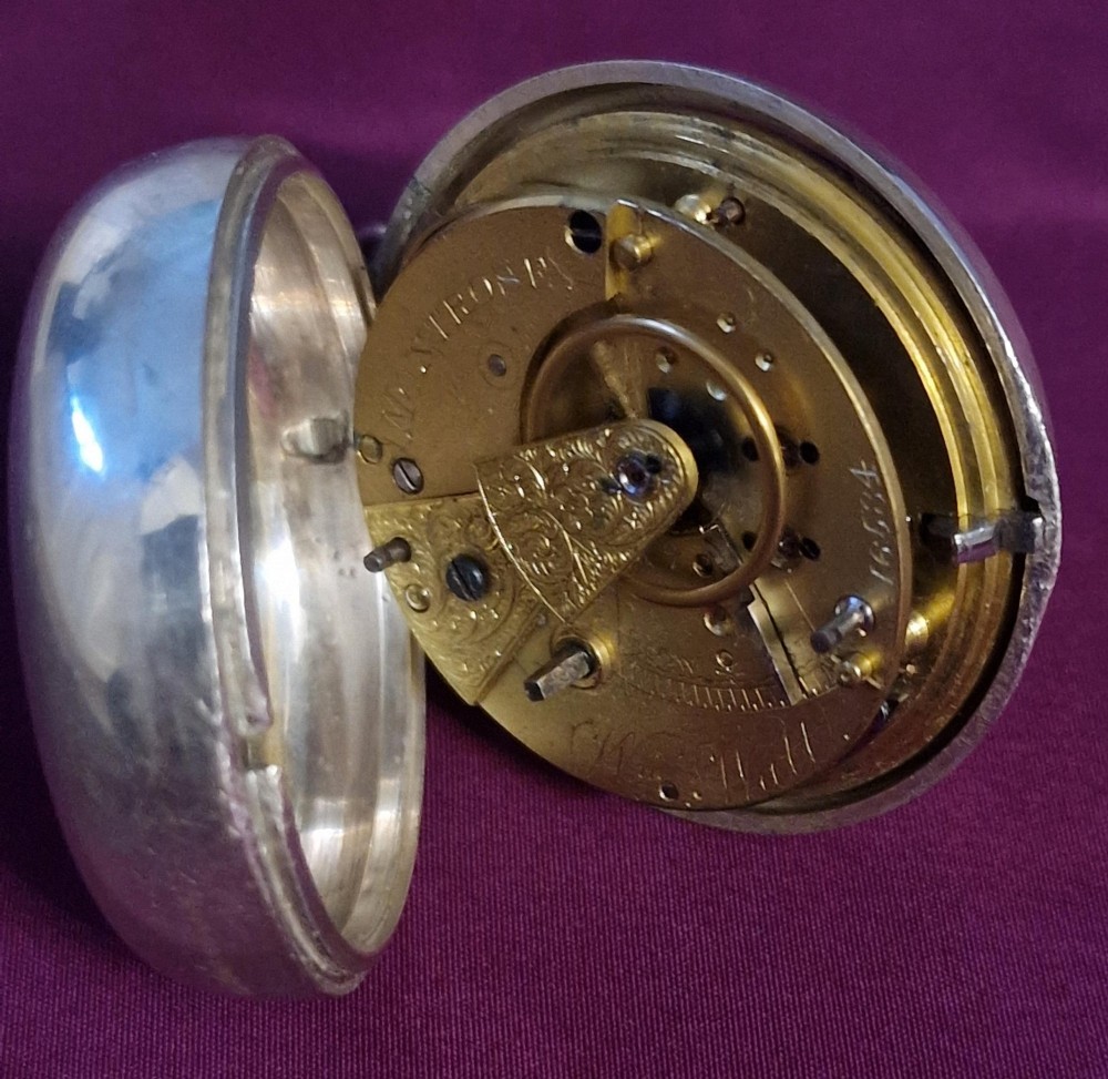 A Georgian gilt verge fusee pocket watch featuring a white enamel dial with Roman numerals and a textured twisted suspension loop. View VII