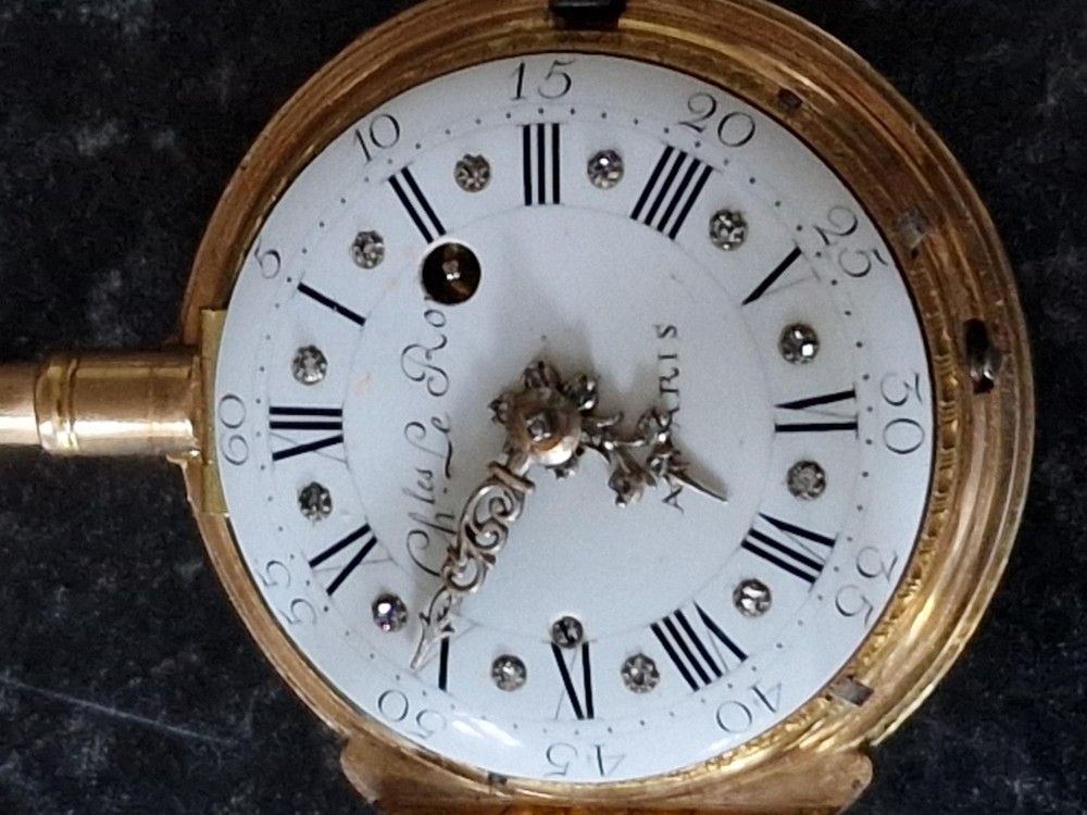 An eighteenth-century French gold quarter repeating pocket watch featuring a white enamel dial with Roman numerals, ornamental hands, and a jewel-encrusted bezel. View III